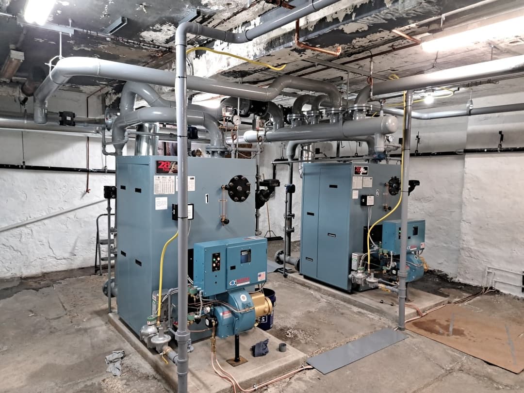 Commercial boiler room with gas-fired boilers and connected piping